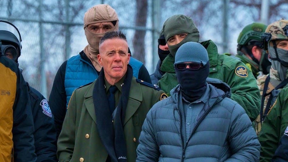 US Border Patrol Chief Gregory Bovino (front left) stands at an anti-ICE demonstration in Fort Snelling, Minnesota, after a federal agent fatally shot US citizen Renee Good on January 7.