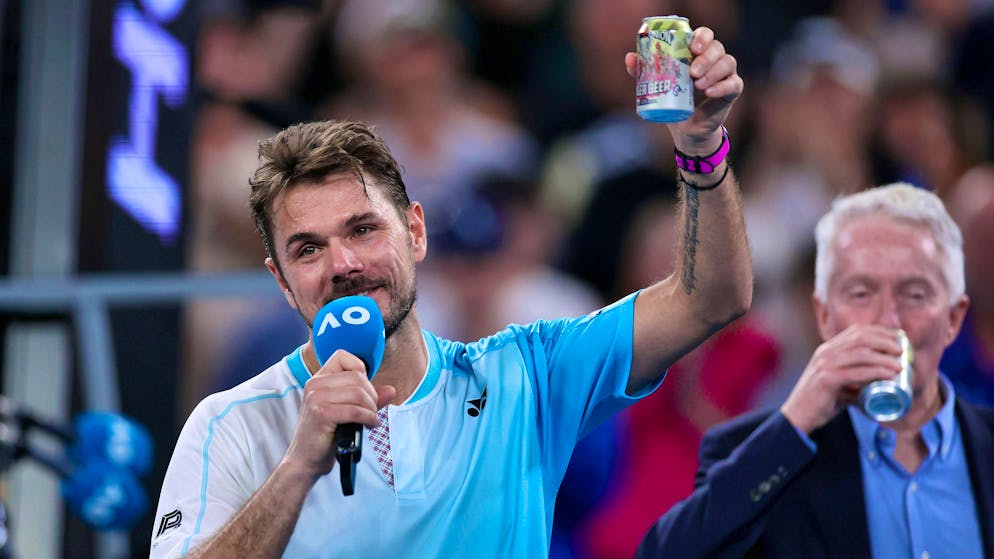 Stan Wawrinka drinks a beer with tournament director Craig Tiley.
