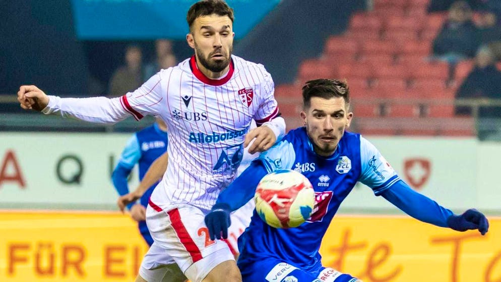 Luzern's goalscorer Adrian Grbic (right) holds off Kreshnik Hajrizi