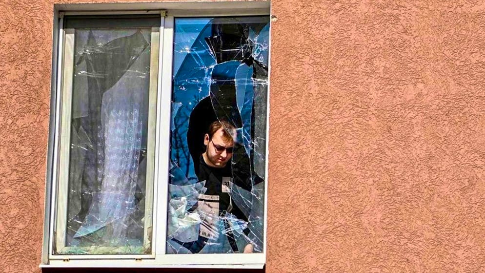 HANDOUT - In this photo released by the Telegram channel of Belgorod Region Governor Vyacheslav Gladkov via AP, a man looks at the broken window of his house after shelling by Ukraine. Photo: Uncredited/AP/dpa (archive image) - ATTENTION: For editorial use only and only with full attribution of the above credit