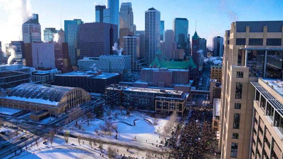 ARCHIVE - Protesters march down the street in downtown Minneapolis. Photo: Abbie Parr/AP/dpa