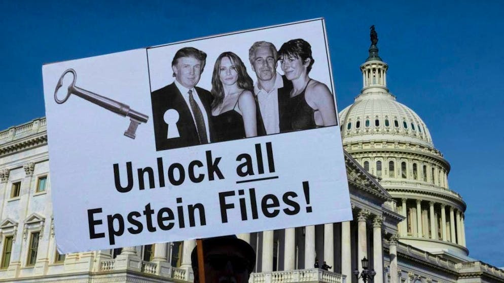 ARCHIVE - Protesters hold up signs during a press conference on the Epstein Files Transparency Act in Washington. Photo: Mehmet Eser/ZUMA Press Wire/dpa/Archive image