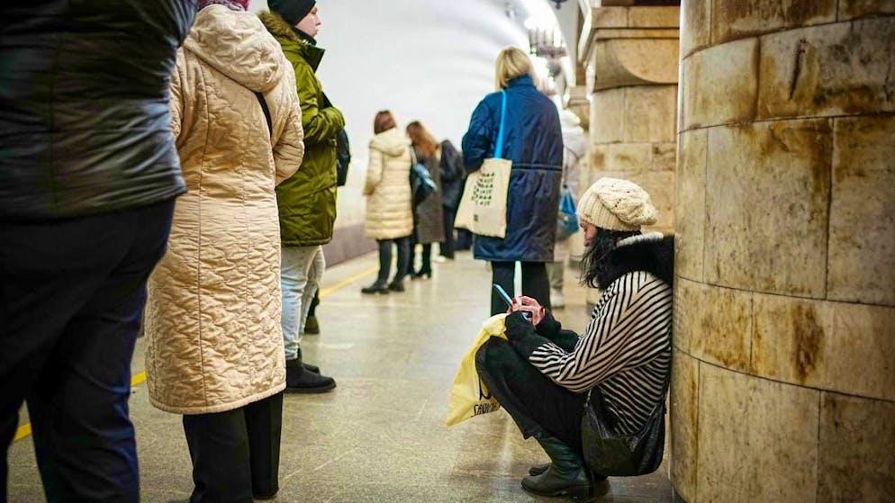 ARCHIVE - Passers-by stand and crouch during an air raid on the metro in the Ukrainian capital Kiev. February 24, 2023 marks the first anniversary of the Russian war of aggression against Ukraine. Photo: Kay Nietfeld/dpa
