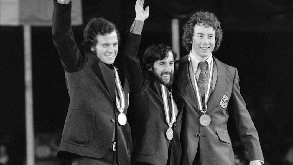 The medal winners of the giant slalom at the 1976 Winter Olympics in Innsbruck: Heini Hemmi (center) celebrates with Ernst Good (left) and Ingemar Stenmark (right).