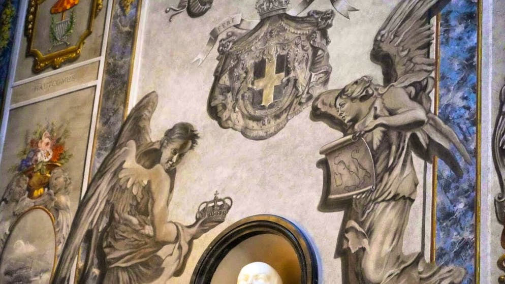 The angel on the right in the picture now has a different face.