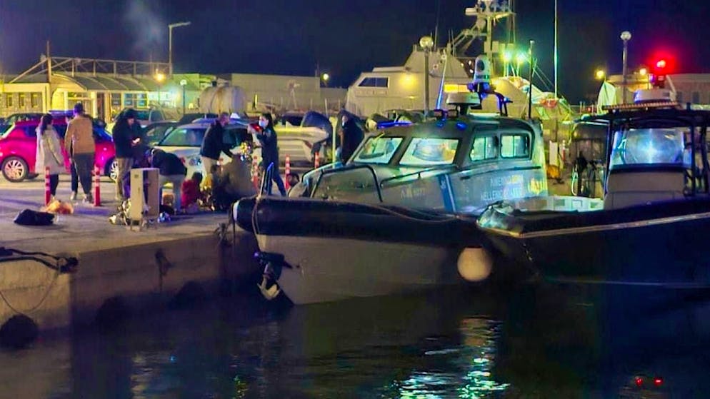 Greek coast guard officers carry out rescue operations in a port on the eastern Aegean island of Chios.