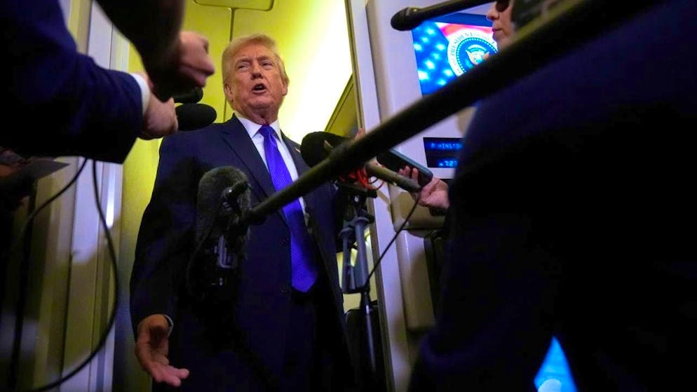 US President Donald Trump speaks on board Air Force One. (archive image)