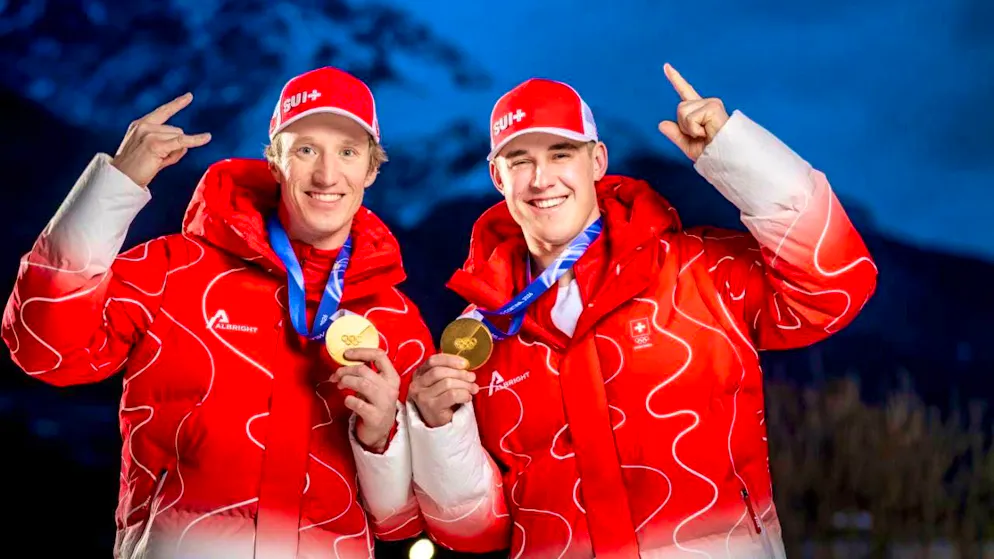 Tanguy Nef (left) and Franjo von Allmen show off their team gold