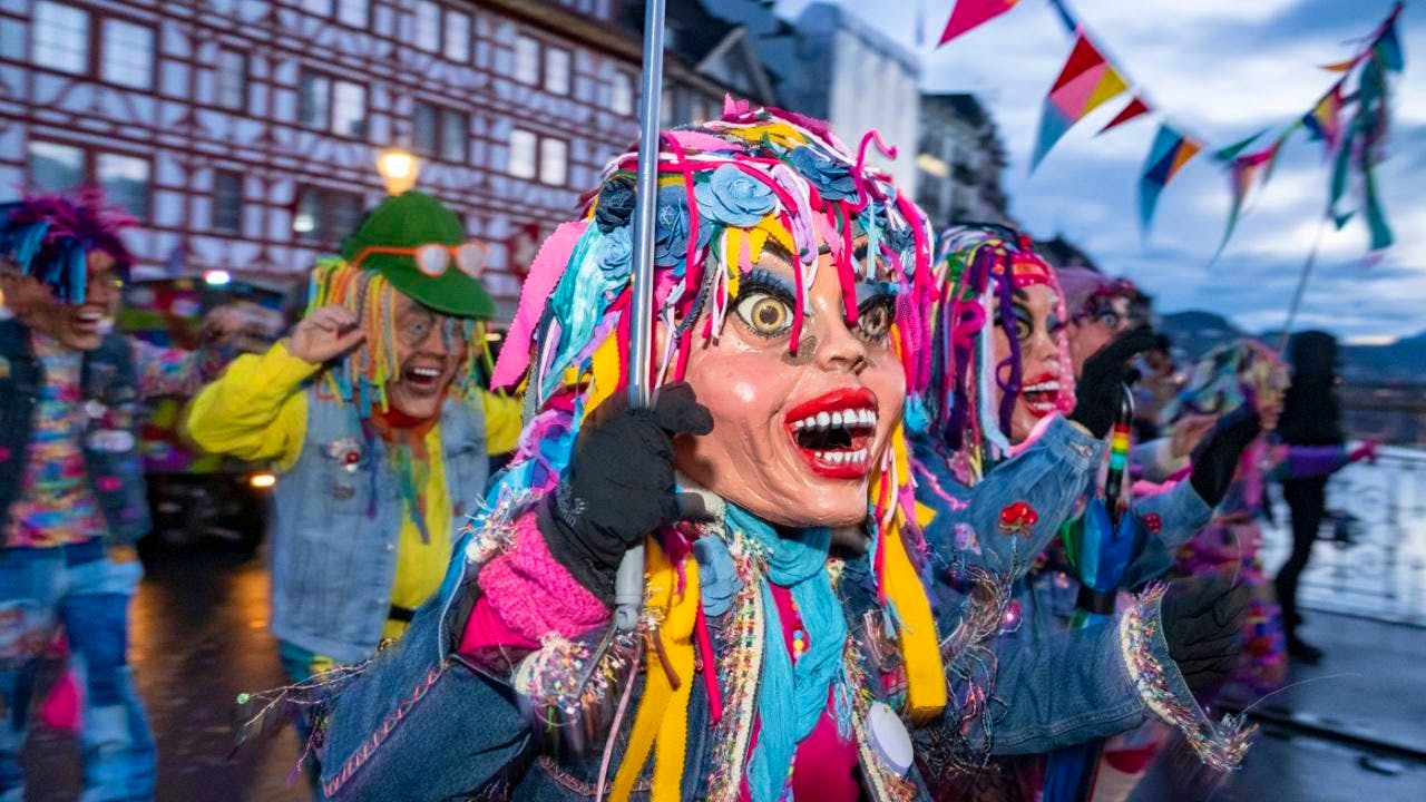 Carnival. Colorful and loud Fritschium parade through the city of Lucerne