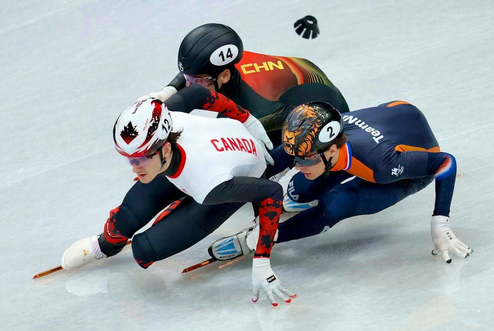 The best pictures of the 2026 Olympic Games in Milano Cortina. Felix Roussel (left), Jens van 't Wout (right) and Liu Shaoang don't give away a single meter in short track.