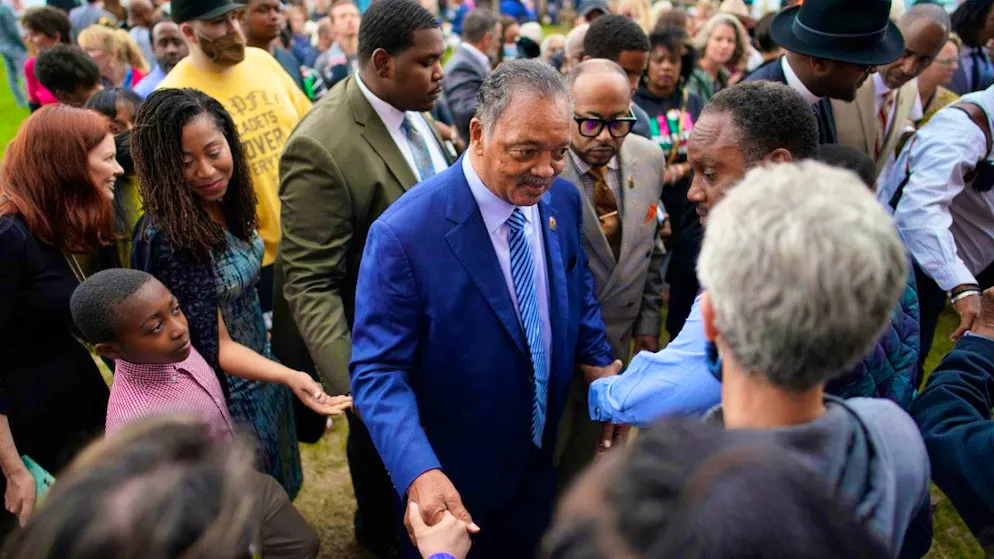 ARCHIVE - Rev. Jesse Jackson (M) greets people after dedicating a prayer wall outside the historic Vernon African Methodist Episcopal Church in the Greenwood neighborhood to mark the 100th anniversary of his death. Photo: John Locher/AP/dpa