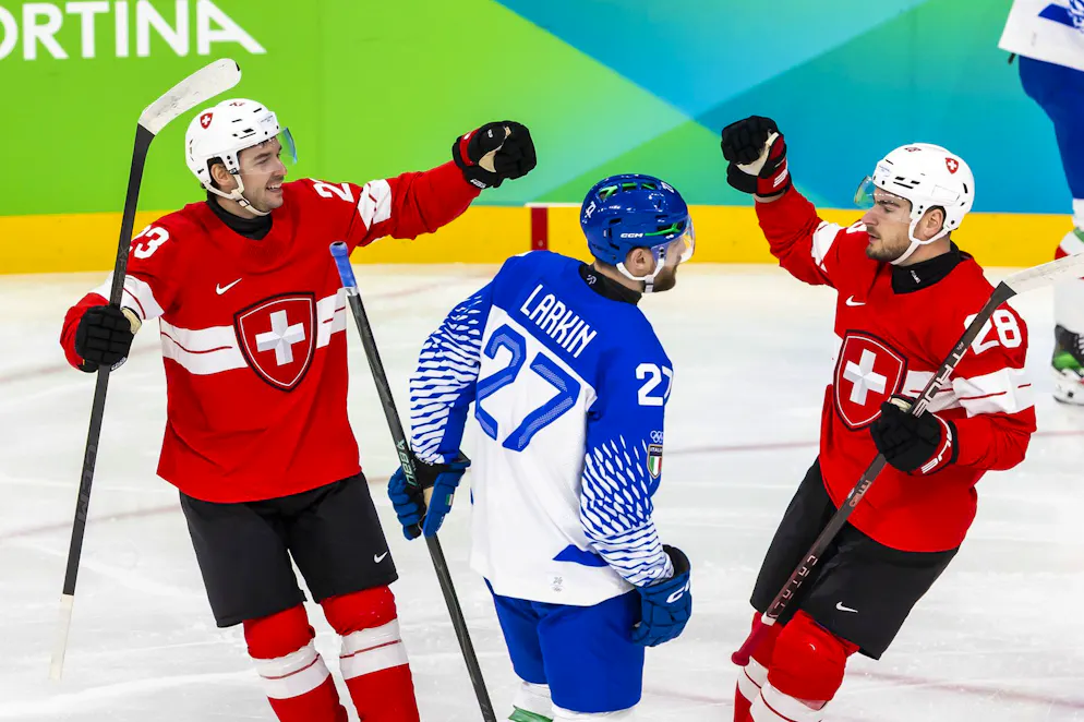 Seconda settimana delle Olimpiadi di Milano-Cortina. Philipp Kurashev, (sinistra) celebra il suo gol con  Timo Meier.