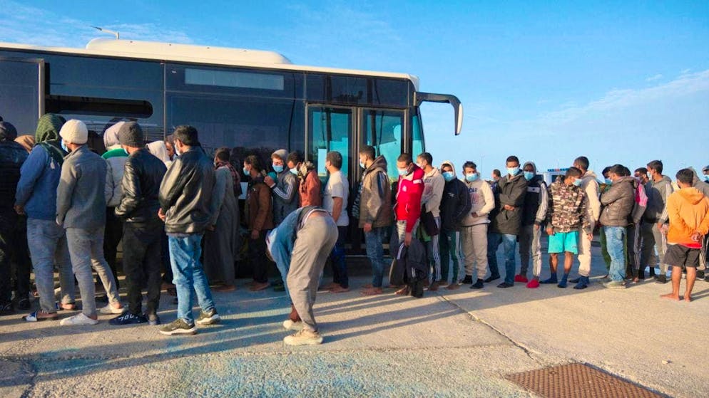 ARCHIVE - Migrants walk to a bus in the port of Paliochora on the island of Crete, after a night-time rescue operation by the coastguard near the small island of Gavdos in southern Greece. Photo: Giannis Angelakis/AP/dpa