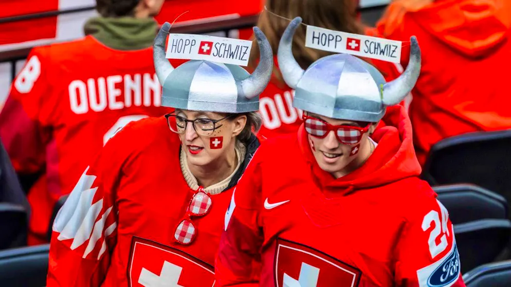 Alina Müller writes the next Olympic fairytale - Gallery. Two Swiss fans cheer on their team