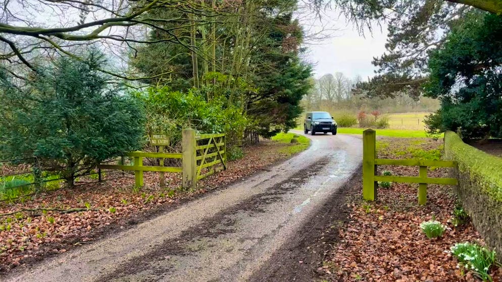 A car leaves the royal estate at Sandringham after Andrew Mountbatten-Windsor was arrested by British police on suspicion of abuse of office.
