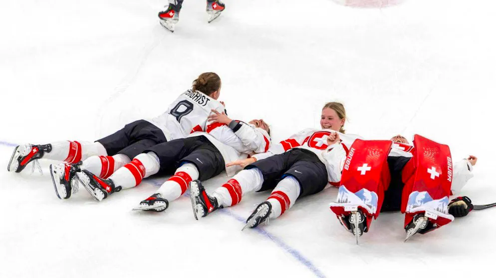 Alina Müller writes the next Olympic fairytale - Gallery. Swiss goalkeeper Andrea Brändli (right) lies down on the ice with teammates after the end of the game