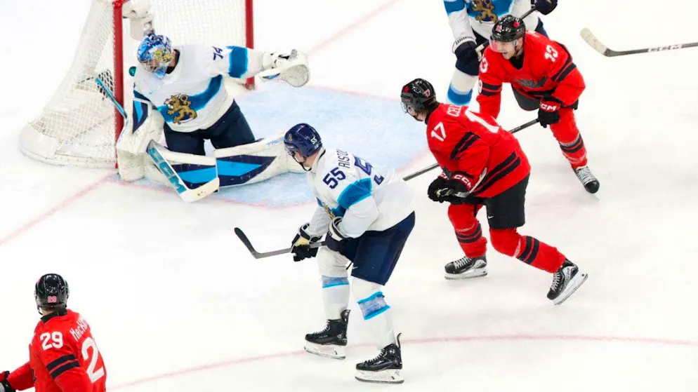 The winning goal in the last minute: Nathan MacKinnon (below with No. 29) beats Finland's goalie Juuse Saros from an acute angle to make it 3-2.