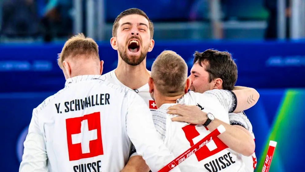 Four friends celebrate Olympic bronze: Yannick Schwaller's curling team.