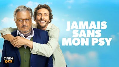 Filmplakat: Ein ernster Mann im blauen Anzug und ein lächelnder Mann, der ihn umarmt, vor blauem Himmel. Text: 