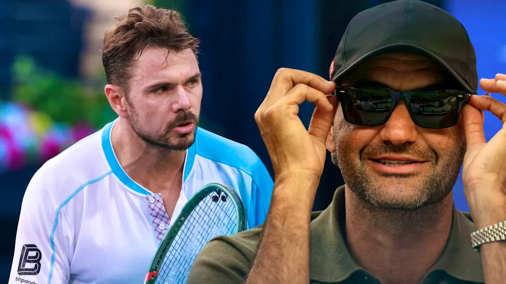 Roger Federer watches Stan Wawrinka at work.