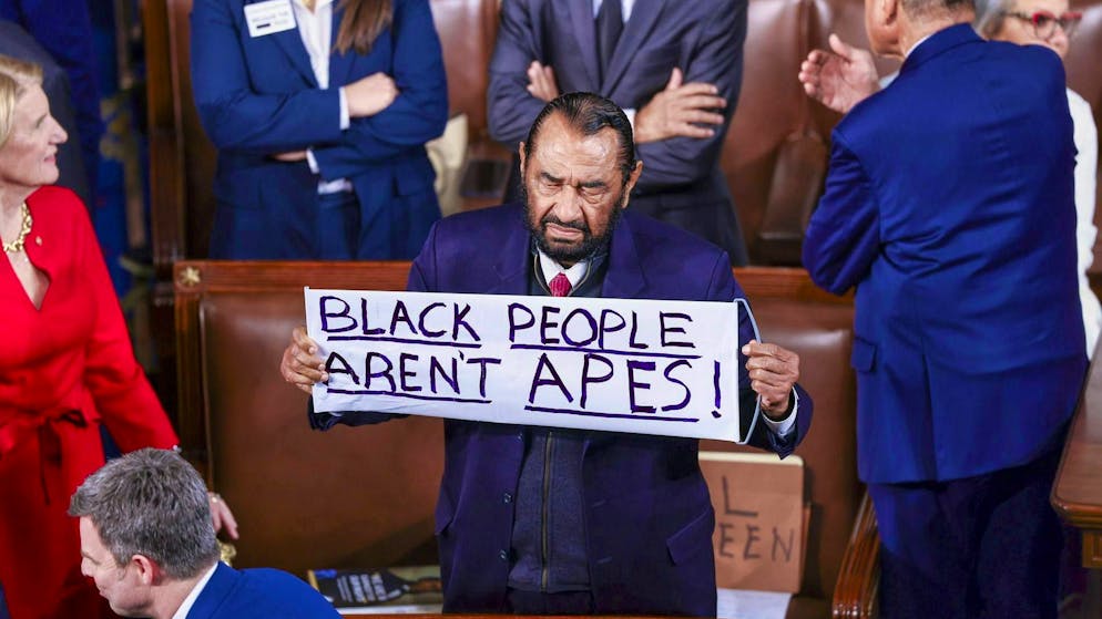 Democratic US Congressman Al Green from Texas protests against racism during Trump's State of the Union address.
