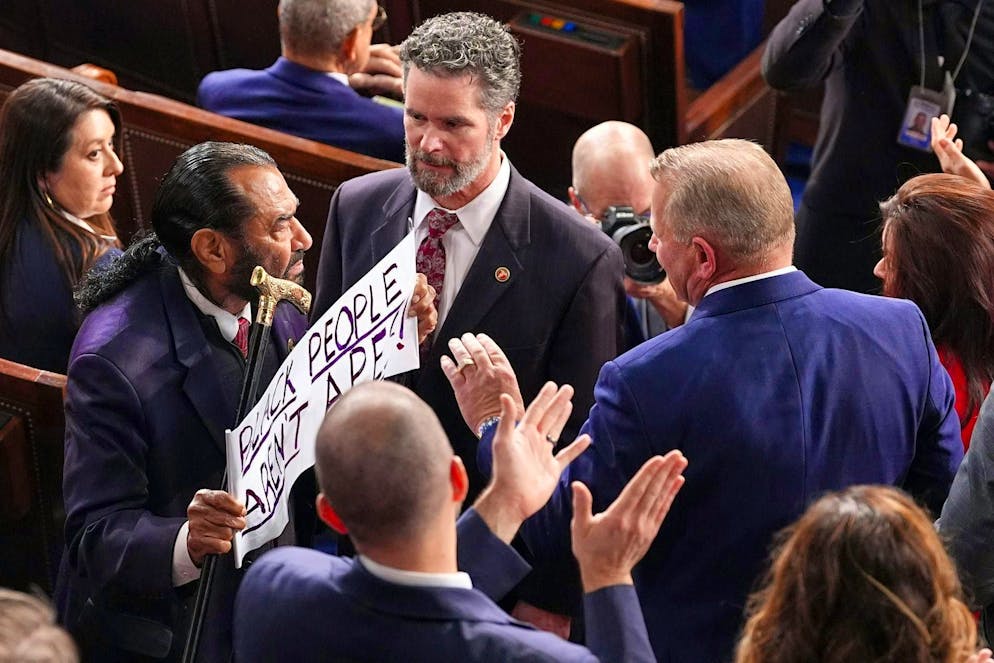 Here the parliamentarian from Texas is being taken away.