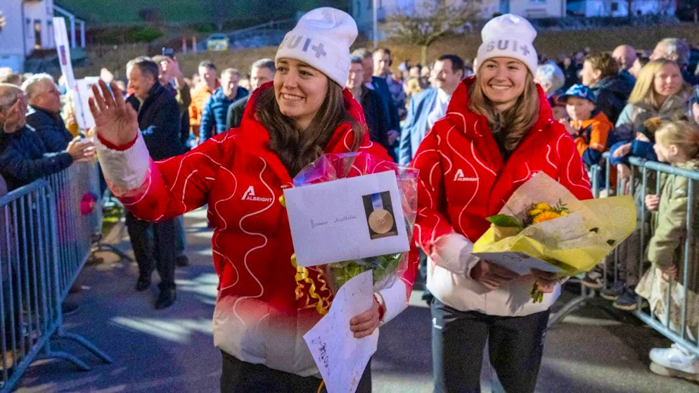 Mathilde Gremaud (left) and Marianne Fatton were duly celebrated after their Olympic victory in La Roche in the canton of Fribourg.