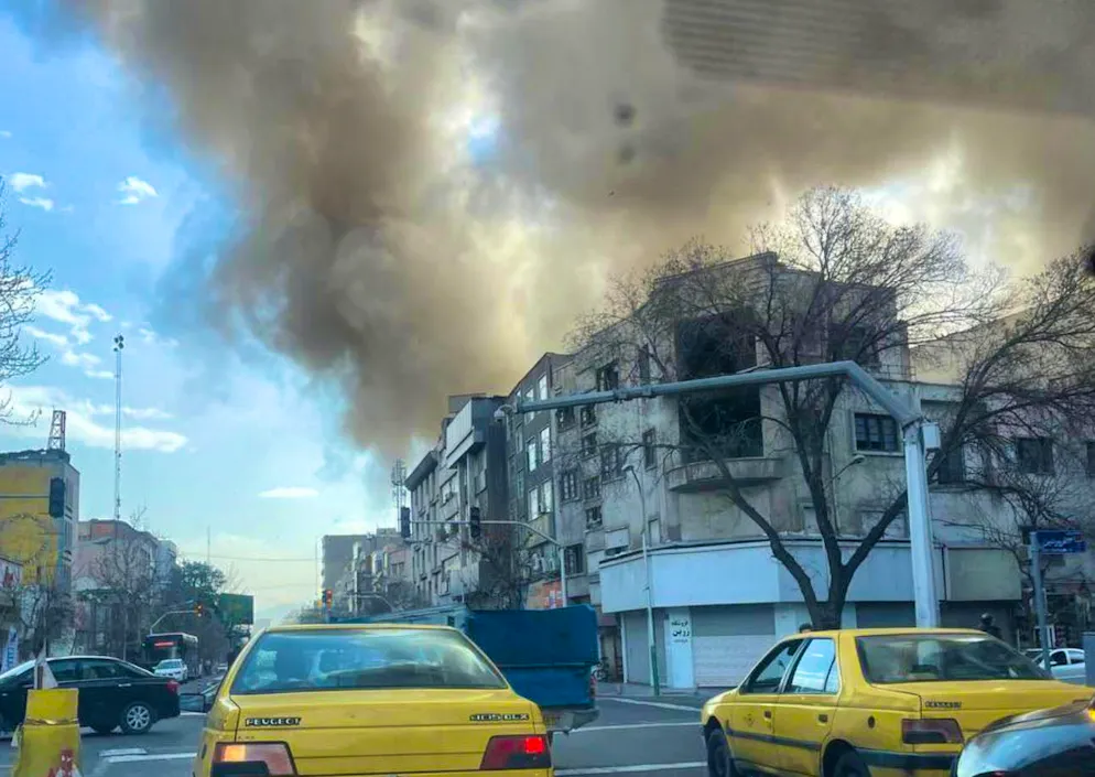 Dense clouds of smoke rise over Tehran.