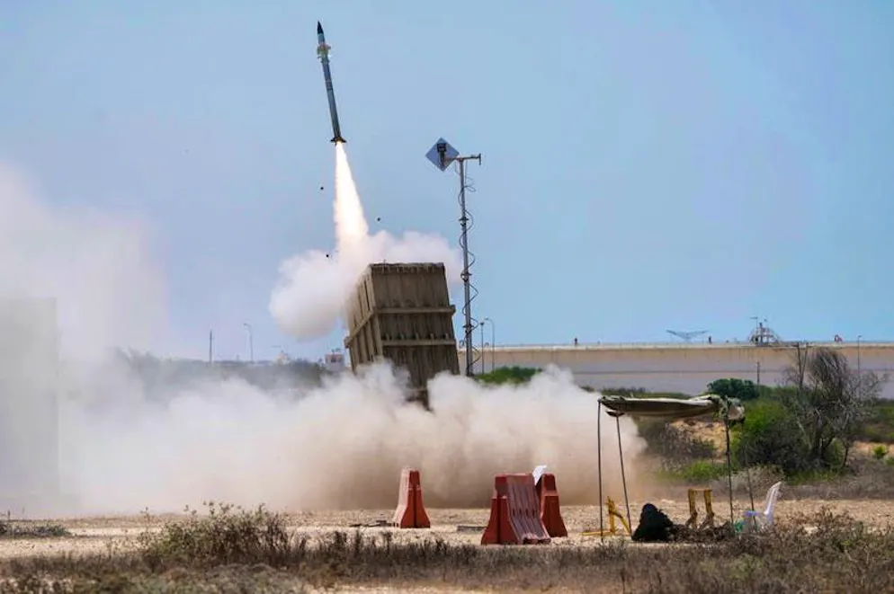 USA and Israel attack Iran. An Israeli soldier takes cover near Ashkelon as the Israeli missile defense system "Iron Dome" launches to intercept a rocket fired from the Gaza Strip. Israel has mobilized 70,000 reservists for the operation against Iran.