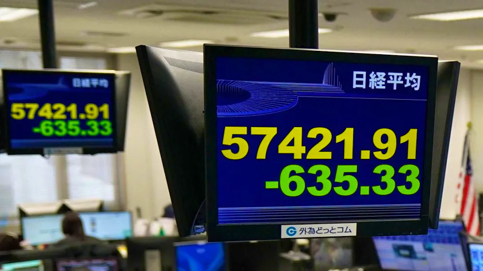 Electronic scoreboards show the Japanese Nikkei index, which slumped again on Wednesday. (archive picture)