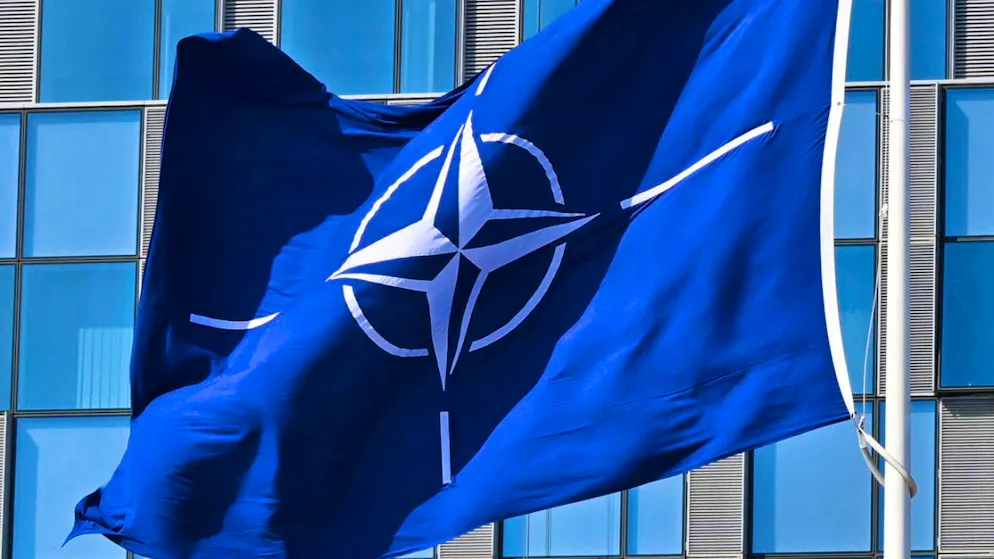 SYMBOL IMAGE - A NATO flag flies in the wind. Photo: Anna Ross/dpa/symbol image