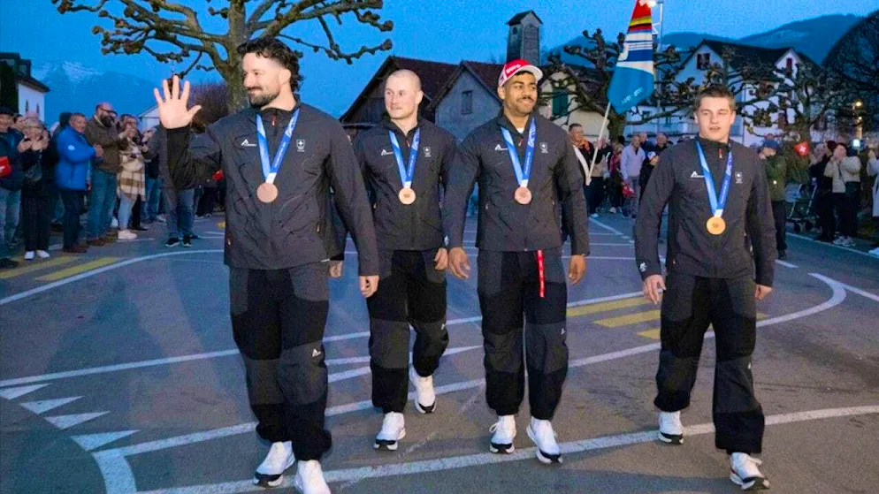 The Swiss bobsleigh Olympic medal winners Michael Vogt, Andreas Haas, Amadou David Ndiaye and Mario Aeberhard (from left) are welcomed in Wangen SZ.