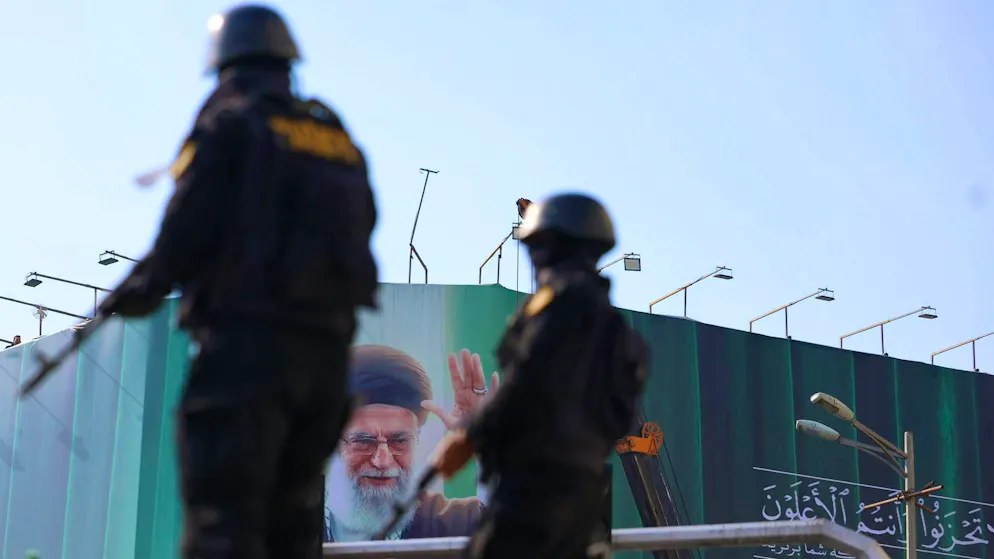 Iranian police officers stand guard in Tehran. (March 9, 2026)