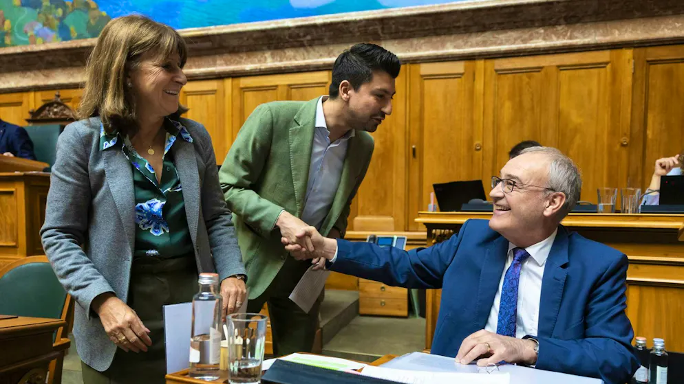 Federal Councillor Guy Parmelin, Fabian Molina, SP-ZH, and Christine Bulliard-Marbach, center-FR, during the spring session of the Federal Assembly, on Tuesday in the National Council in Bern. (from right to left)