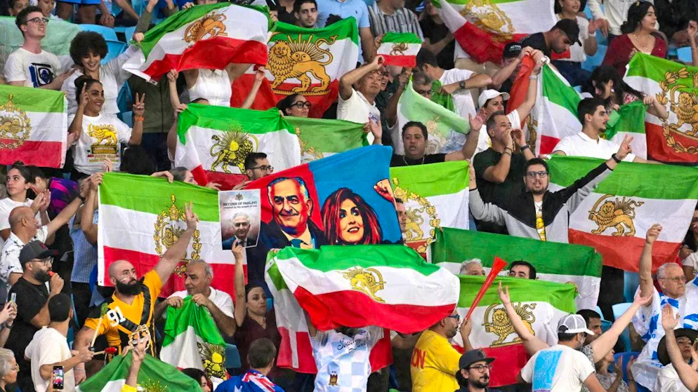 Fans wave their Iranian flags during an Asian Cup football match in Australia