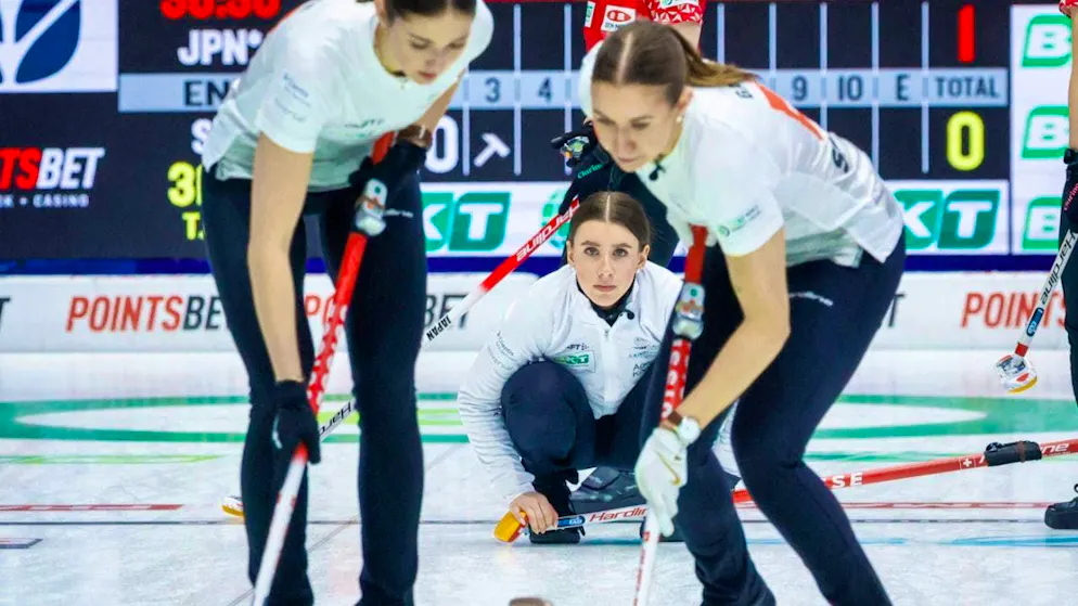 Xenia Schwaller looks after her stone, Selina Rychiger (left) and Selina Gafner accompany her
