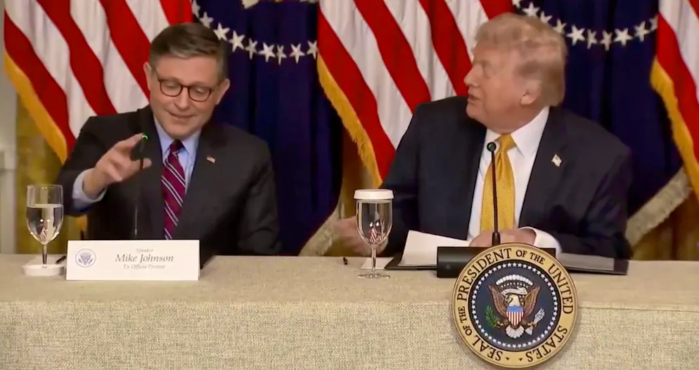 Mike Johnson (left) and Donald Trump at the press conference at the Kennedy Center on March 15.