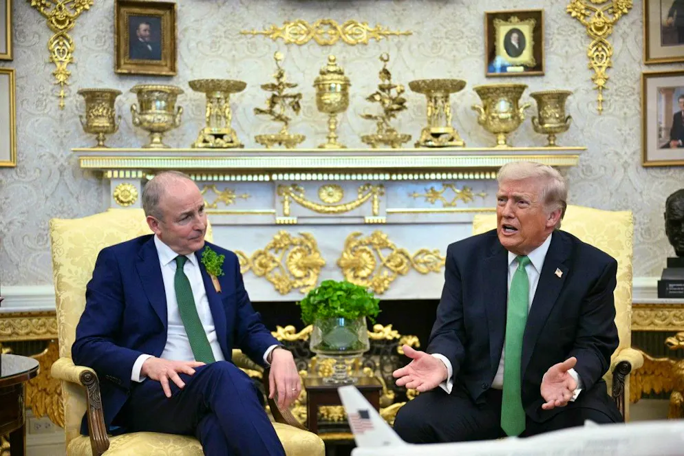 US President Donald Trump meets with Taoiseach of Ireland Micheál Martin during a bilateral meeting in the Oval Office of the White House in Washington, DC on March 17, 2026. The Irish prime minister arrived in the United States March 13 for an annual St Patrick's Day trip under pressure to talk tough to US President Donald Trump amid the Iran war. (Photo by Jim WATSON / AFP)