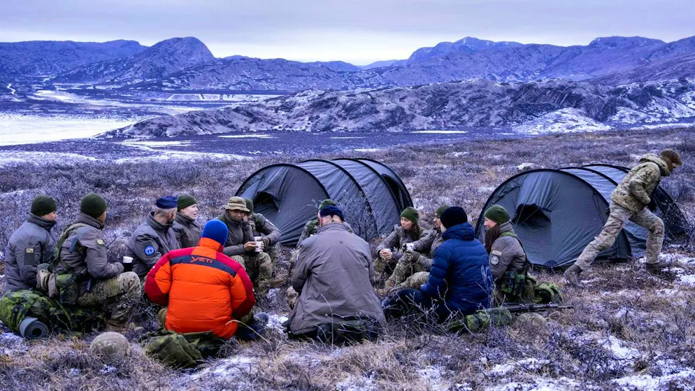 Showing the flag: Denmark's King Frederik X (red jacket) visits Danish soldiers during their training in the Arctic in Kangerlussuaq on Greenlabd on February 20.