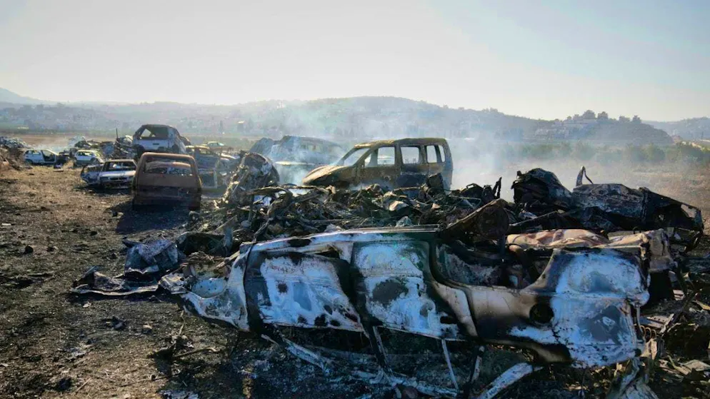 ARCHIVE - Smoke rises from burned cars in a junkyard set on fire by Israeli settlers the night before in the West Bank town of Hawara near Nablus. Photo: Nasser Nasser/AP/dpa
