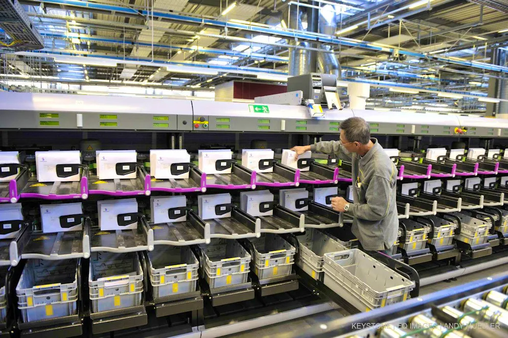 Letter distribution at the Härkingen letter mail distribution center. Swiss Post has to deliver all letters - but you don't have to open them.