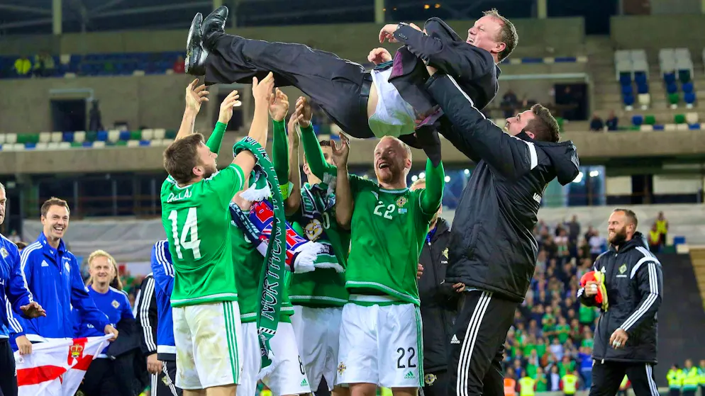 Michael O'Neill is celebrated after qualifying for Euro 2016.