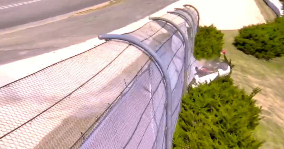 Scott McLaughlin crashes through the safety fence.