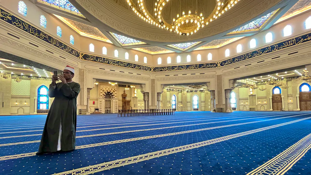 Mosque. Superlative interior: there is room for thousands of worshippers. The huge prayer hall is lined with a continuous blue carpet that defines the rows of prayers - almost like a sea of fabric.