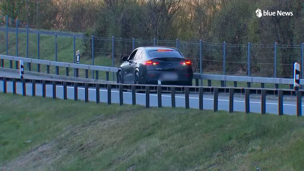 Crazy moment in the Gotthard traffic jam. Here a Mercedes reverses on the emergency lane