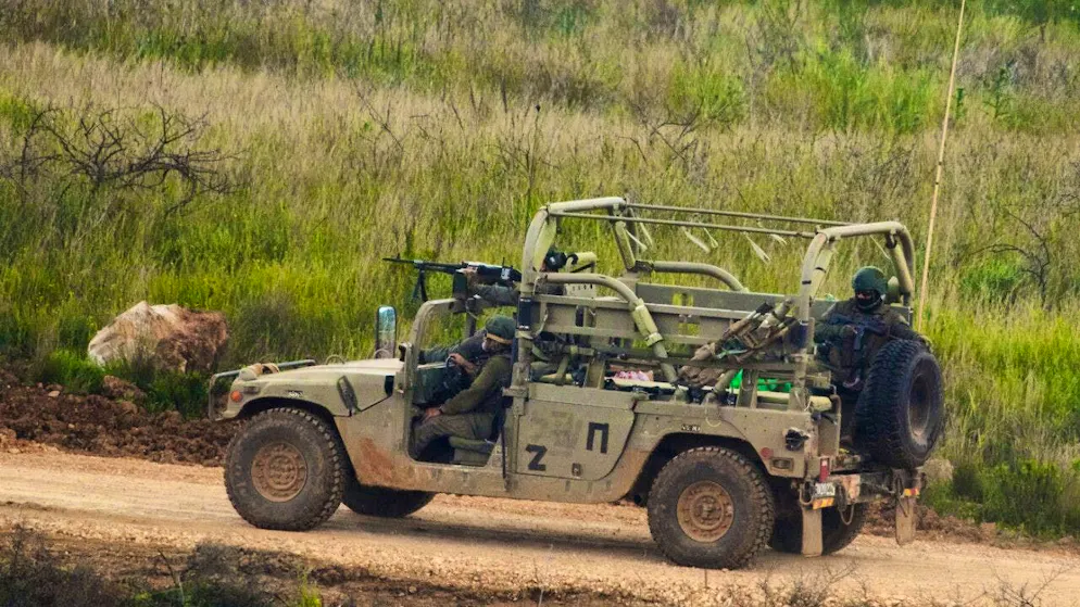 Israeli soldiers driving in southern Lebanon, seen from northern Israel. Photo: Ariel Schalit/AP/dpa