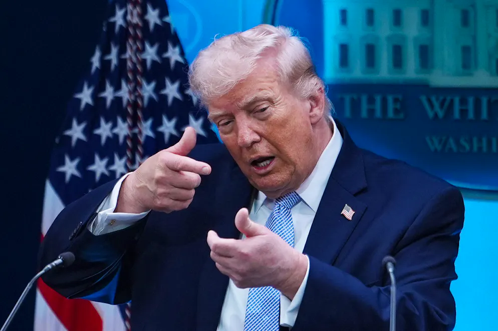 FILE - President Donald Trump pretends to aim a sniper gun while speaking with reporters in the James Brady Press Briefing Room at the White House, Monday, April 6, 2026, in Washington. (AP Photo/Julia Demaree Nikhinson, File)