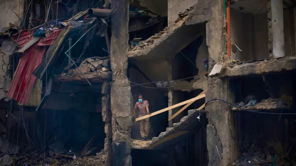 A man stands in a destroyed building in Beirut. Photo: Emilio Morenatti/AP/dpa