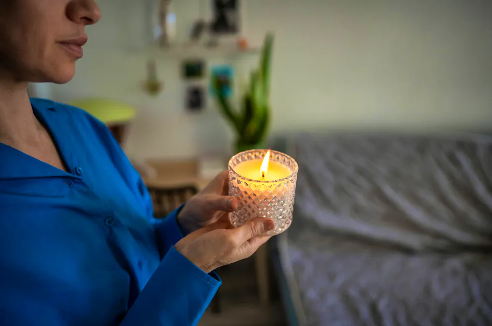 A woman left a candle burning in her apartment. Then there was a fire. Now she is on trial.