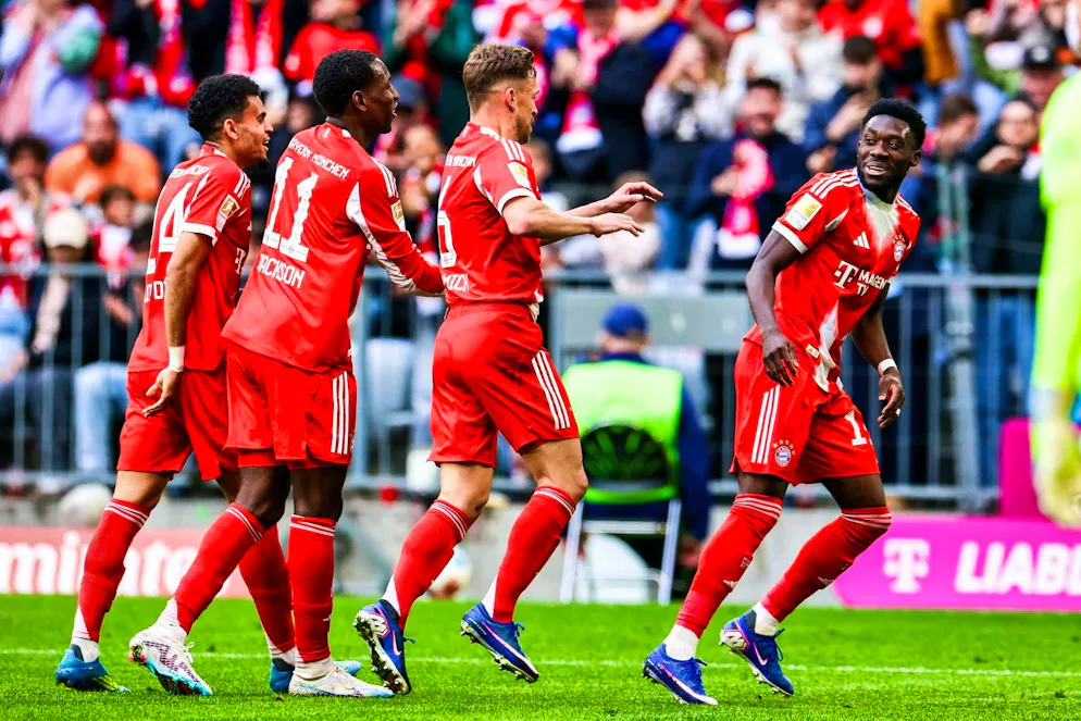Bayern celebrate Alphonso Davies' goal to make it 3-1 against Stuttgart.